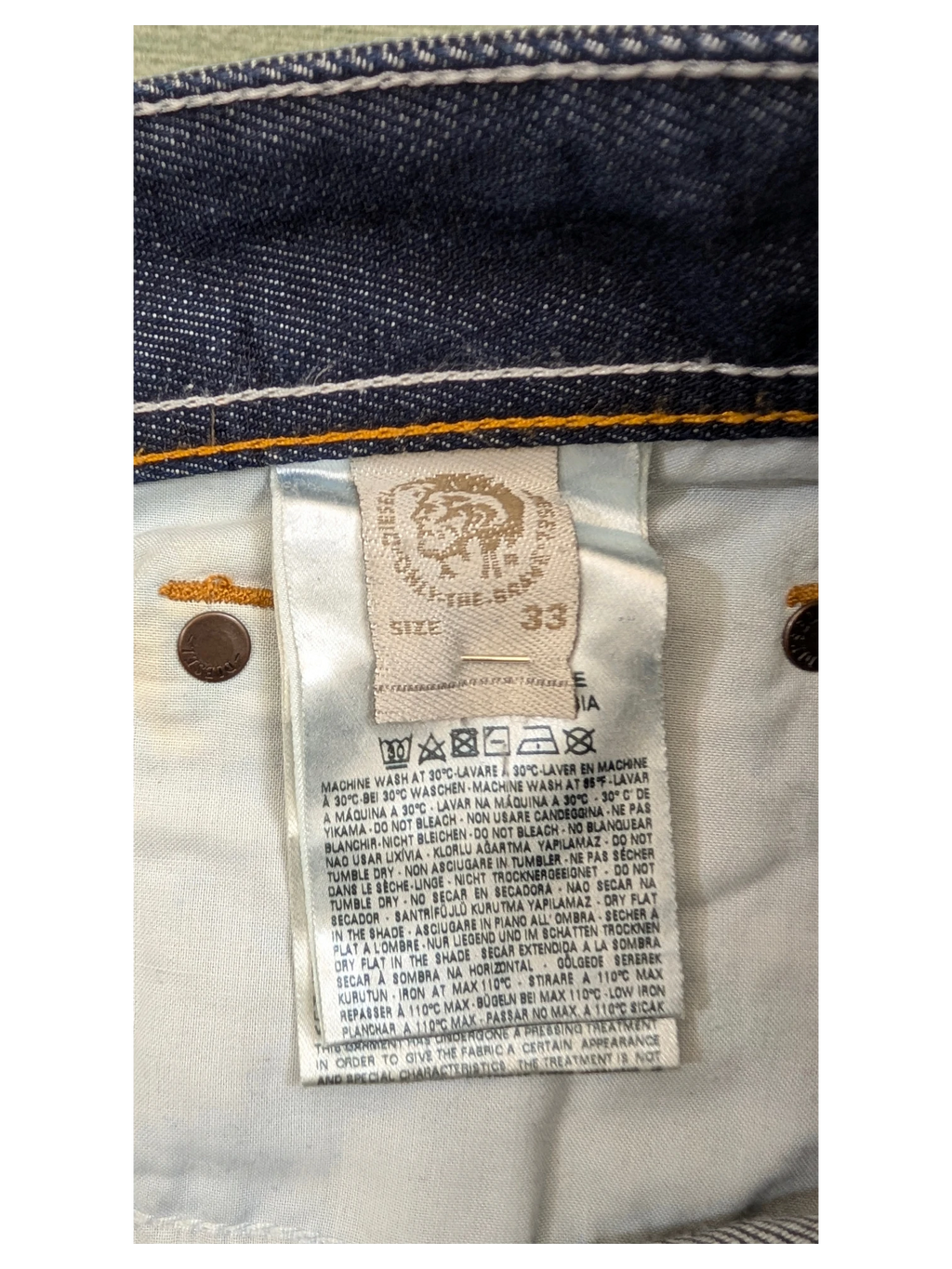 JAKE & IPI Diesel Larkee jeans size 33, dark wash denim with white stitching and branded button.