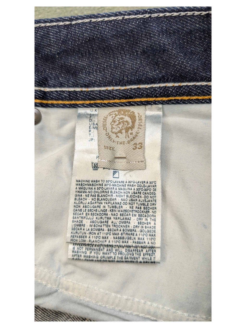 JAKE & IPI Diesel Larkee jeans size 33, dark wash denim with white stitching detail.