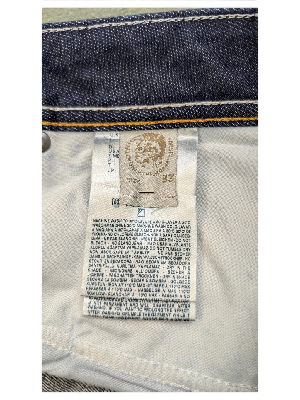 JAKE & IPI Diesel Larkee jeans size 33, dark wash denim with white stitching detail.