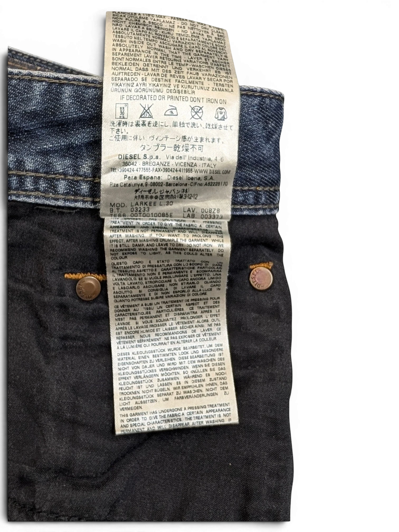 JAKE & IPI Diesel Larkee W34 L30 blue denim jeans with distressed detailing and branded buttons.