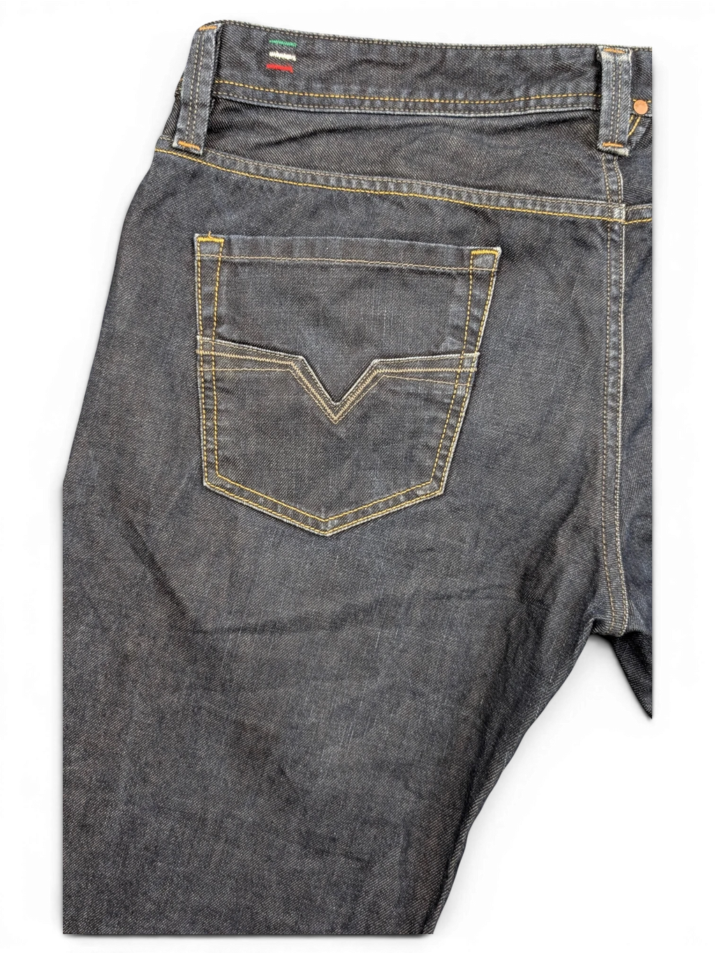 JAKE & IPI dark wash denim jeans with V-stitch back pocket detail and Italian flag tab.