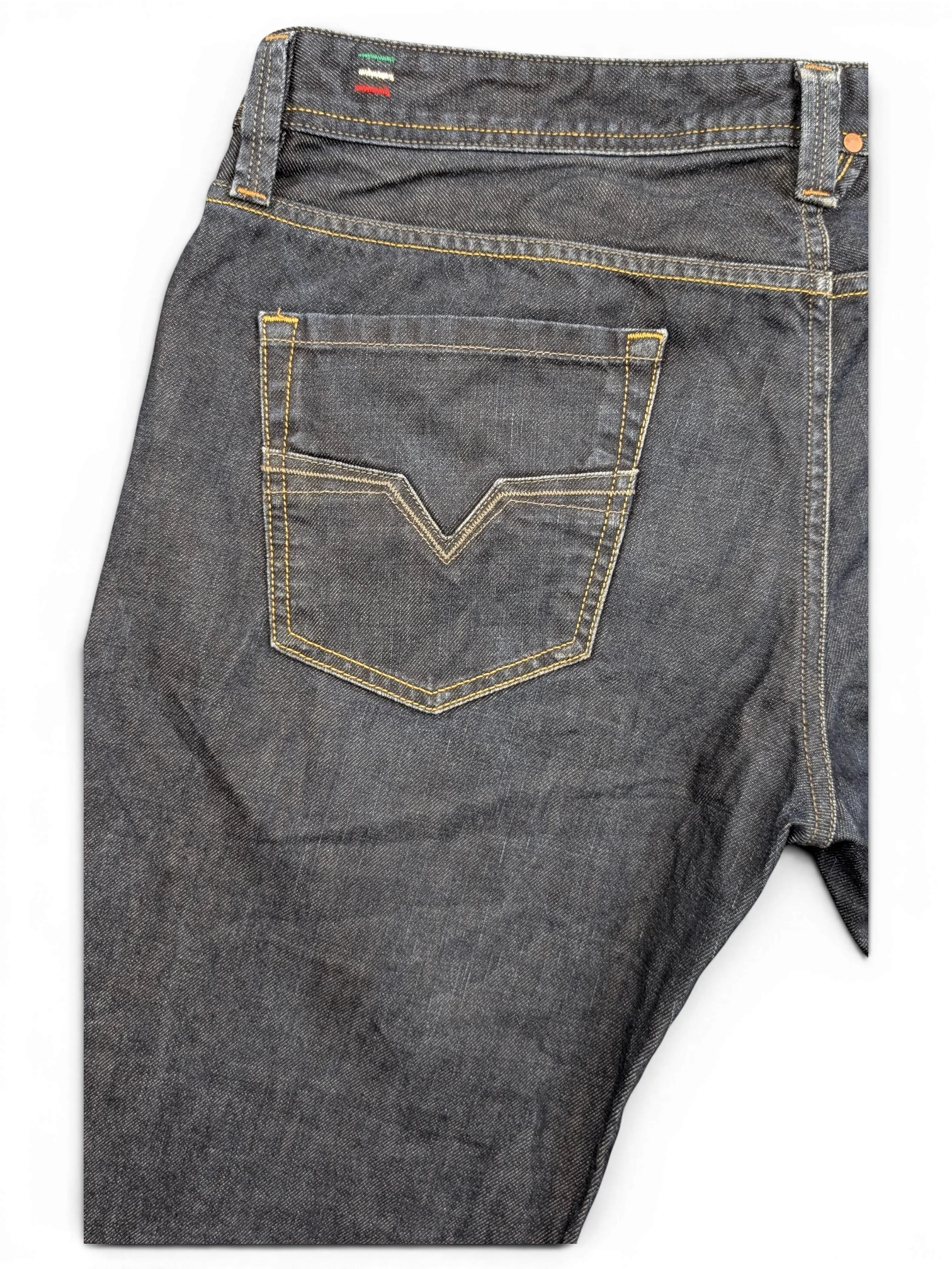 JAKE & IPI dark wash denim jeans with V-stitch back pocket detail and Italian flag tab.