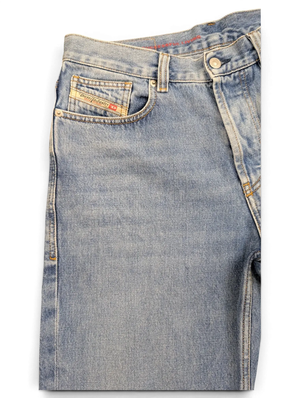 JAKE & IPI light wash denim jeans with red stitching detail and Diesel Industry coin pocket.