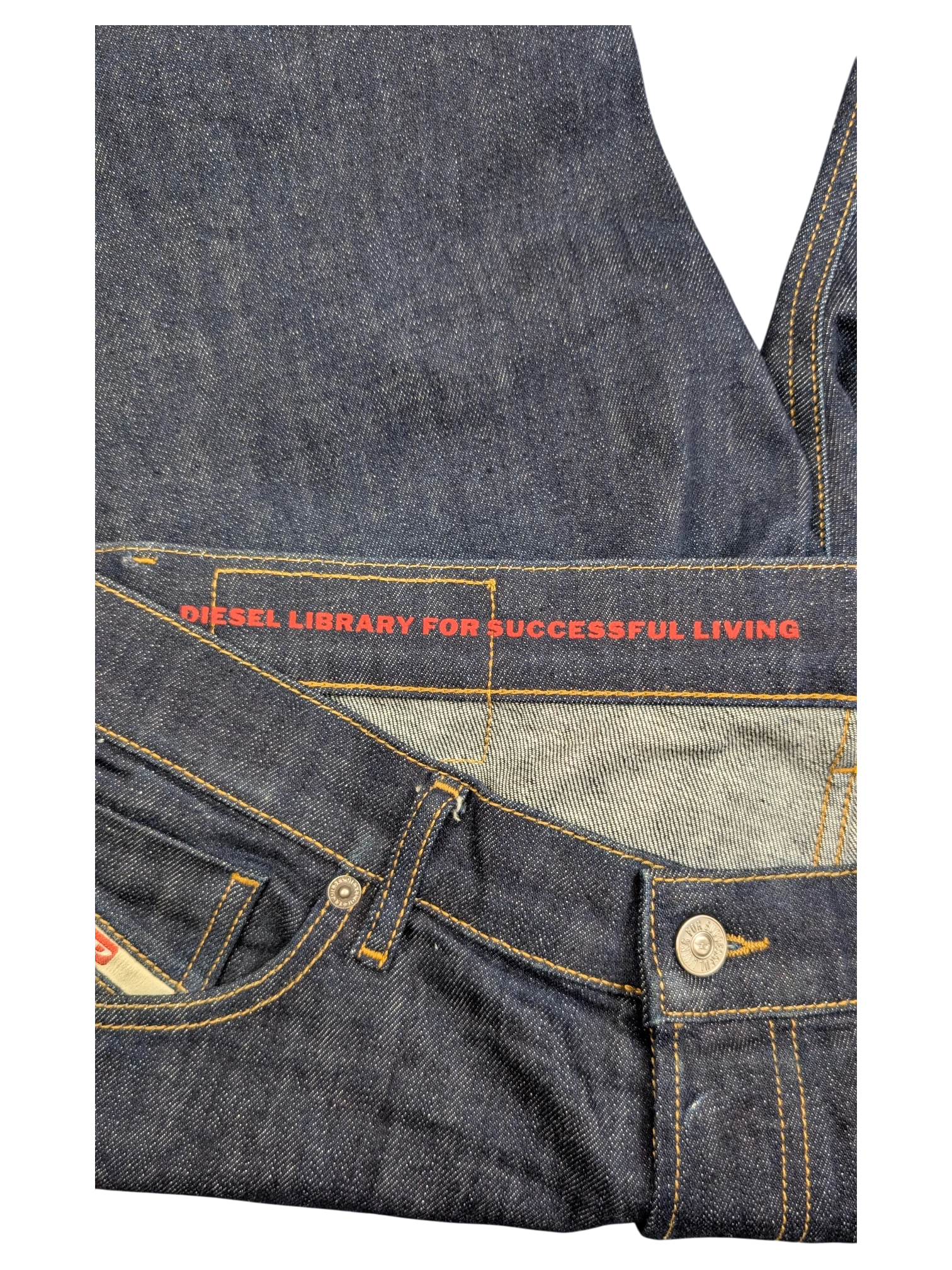 JAKE & IPI dark wash denim jeans with red "DIESEL LIBRARY FOR SUCCESSFUL LIVING" waistband detail. W34 L32.