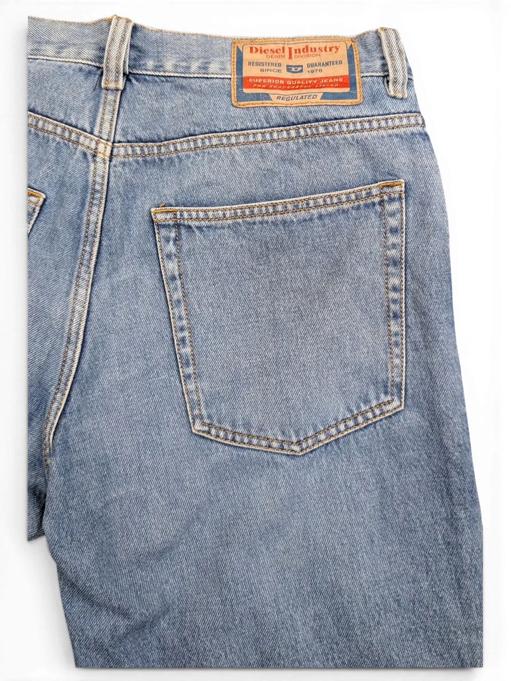 JAKE & IPI light wash denim jeans with classic 5-pocket styling and a leather brand patch.