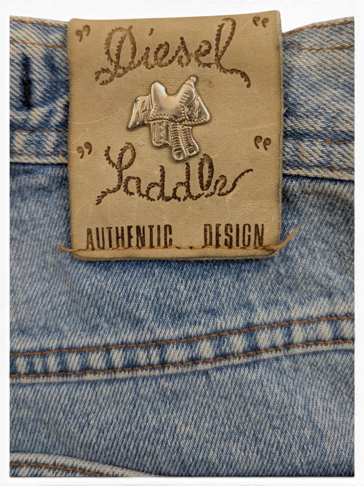 JAKE & IPI Diesel Modern Basic W28 L31 light wash denim jeans with leather patch featuring saddle emblem.