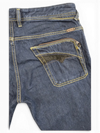 JAKE & IPI Diesel Poiak dark wash denim jeans with yellow stitching and a zippered back pocket with black accent.