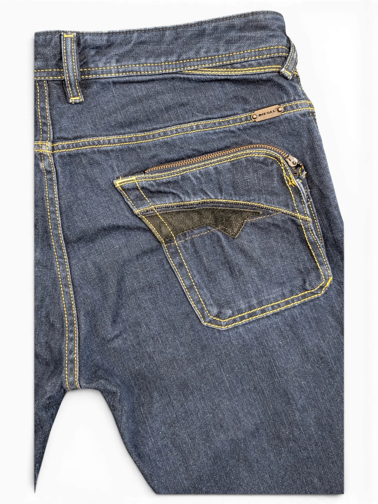 JAKE & IPI Diesel Poiak dark wash denim jeans with yellow stitching and a zippered back pocket with black accent.