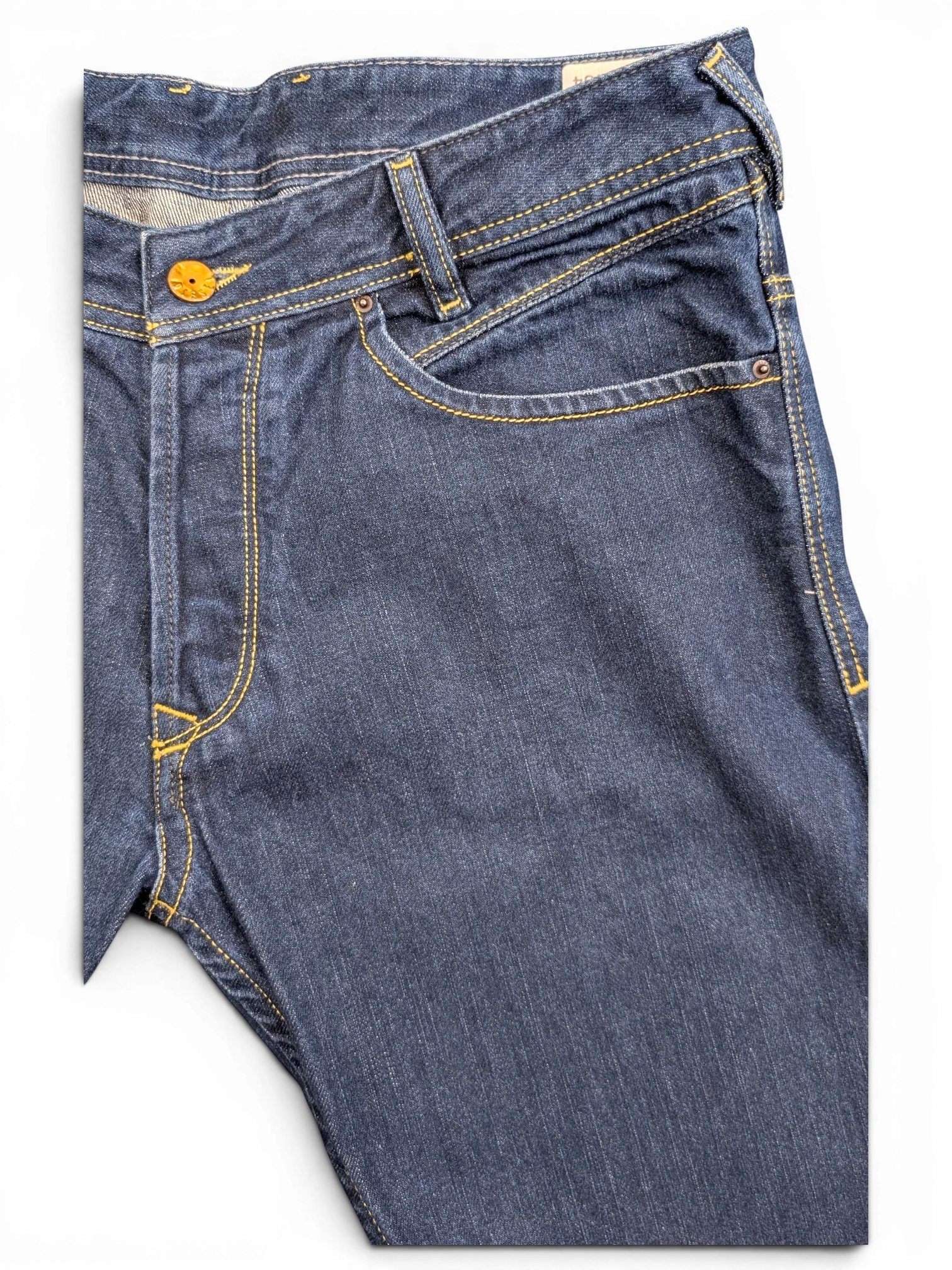 JAKE & IPI dark wash denim jeans with yellow stitching and a button fly. Size W31 L34.