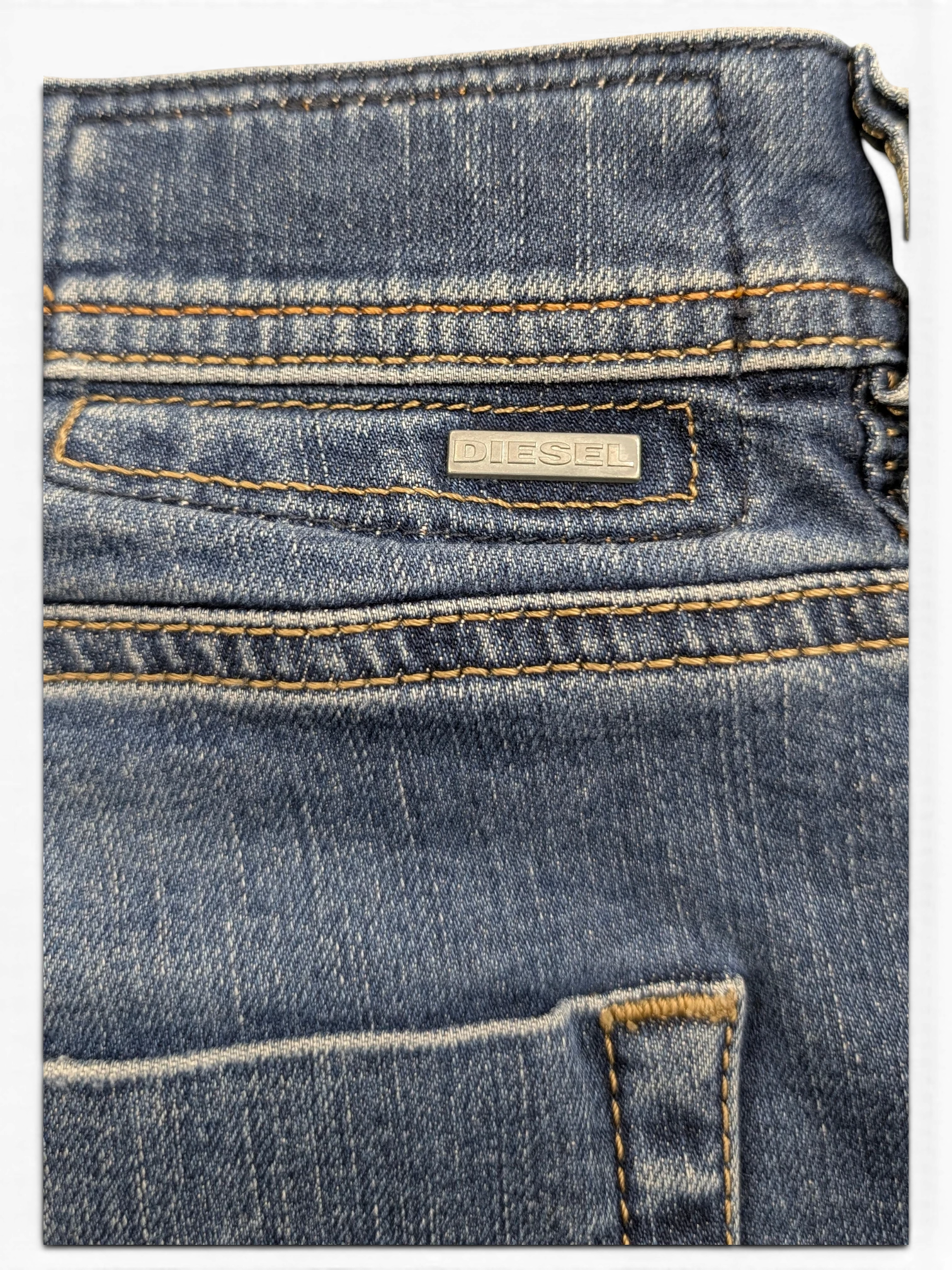 JAKE & IPI Diesel Tepphar blue denim jeans with contrast stitching and metal logo tag.