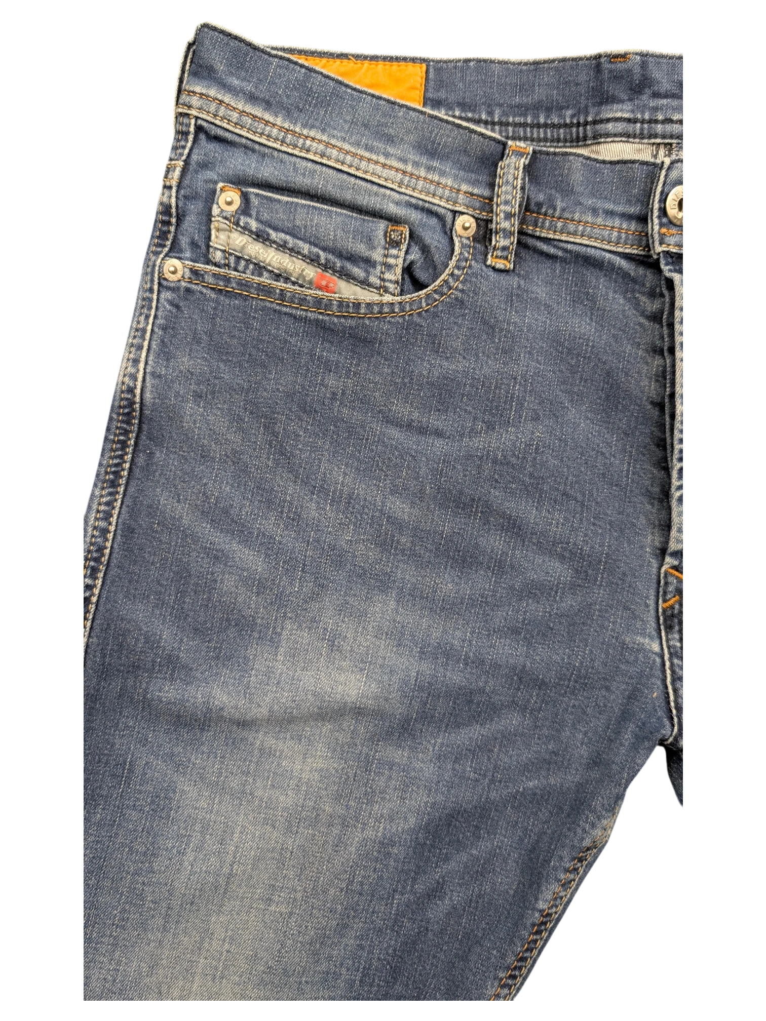 JAKE & IPI Diesel Tepphar blue denim jeans with orange brand tag and red accent on coin pocket.