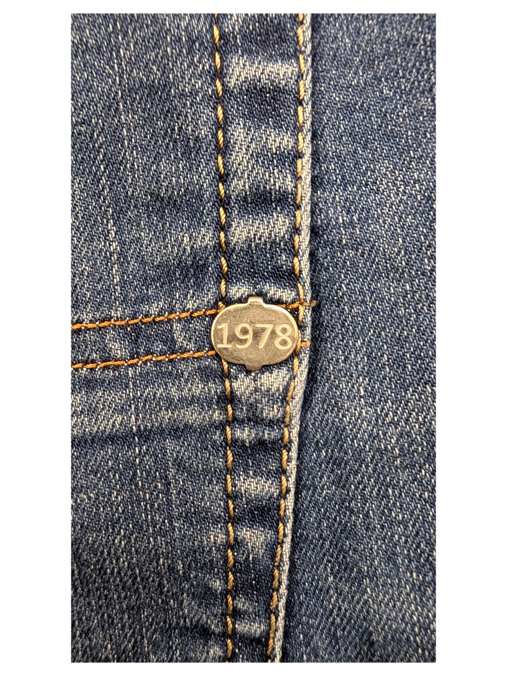 JAKE & IPI Diesel Tepphar jeans with silver button detail featuring the year 1978.