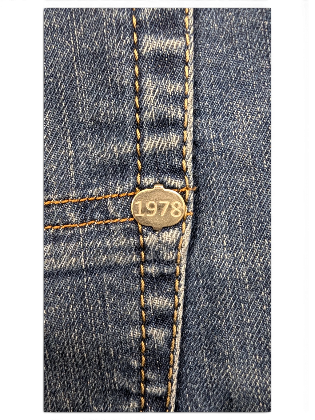 JAKE & IPI Diesel Tepphar jeans with silver button detail featuring the year 1978.