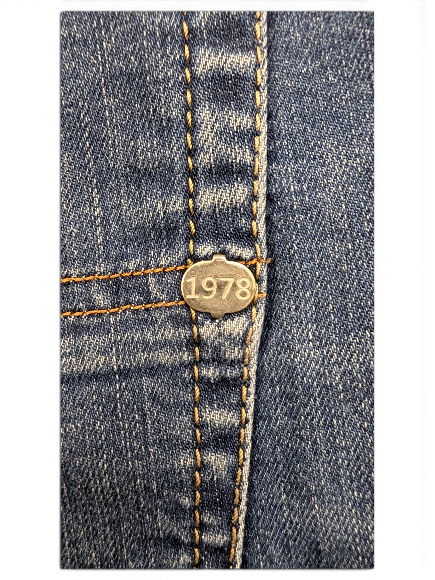 JAKE & IPI Diesel Tepphar jeans with silver button detail featuring the year 1978.