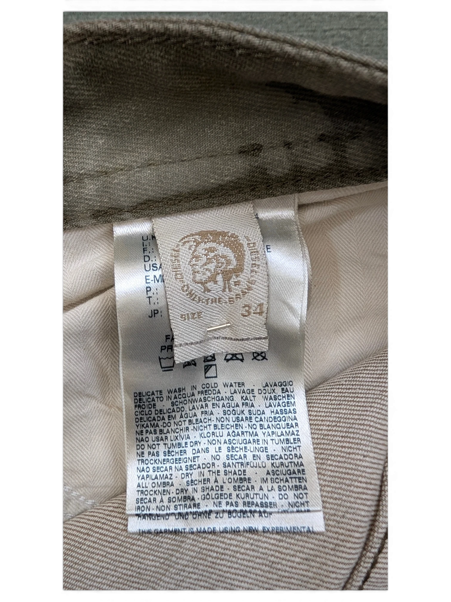 JAKE & IPI Diesel Thavar W34 L32 beige cotton blend jeans with care label detail.