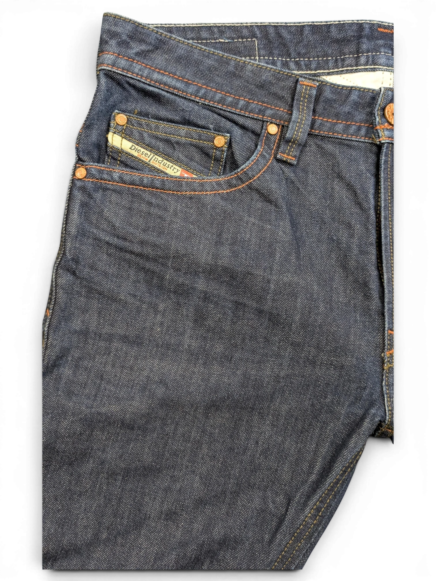 JAKE & IPI Diesel Thavar dark wash denim jeans with orange stitching and Diesel Industry logo patch.