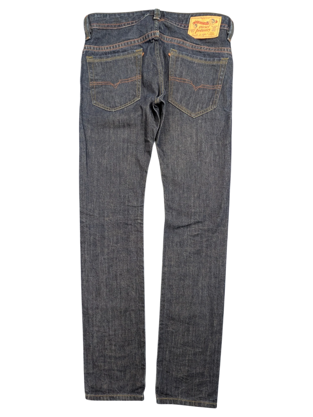 JAKE & IPI Diesel Thavar dark wash denim jeans with orange stitching and signature V-stitching on back pockets.