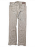 JAKE & IPI Diesel Thavar W34 L32 light brown denim jeans with classic five-pocket styling and a leather logo patch.