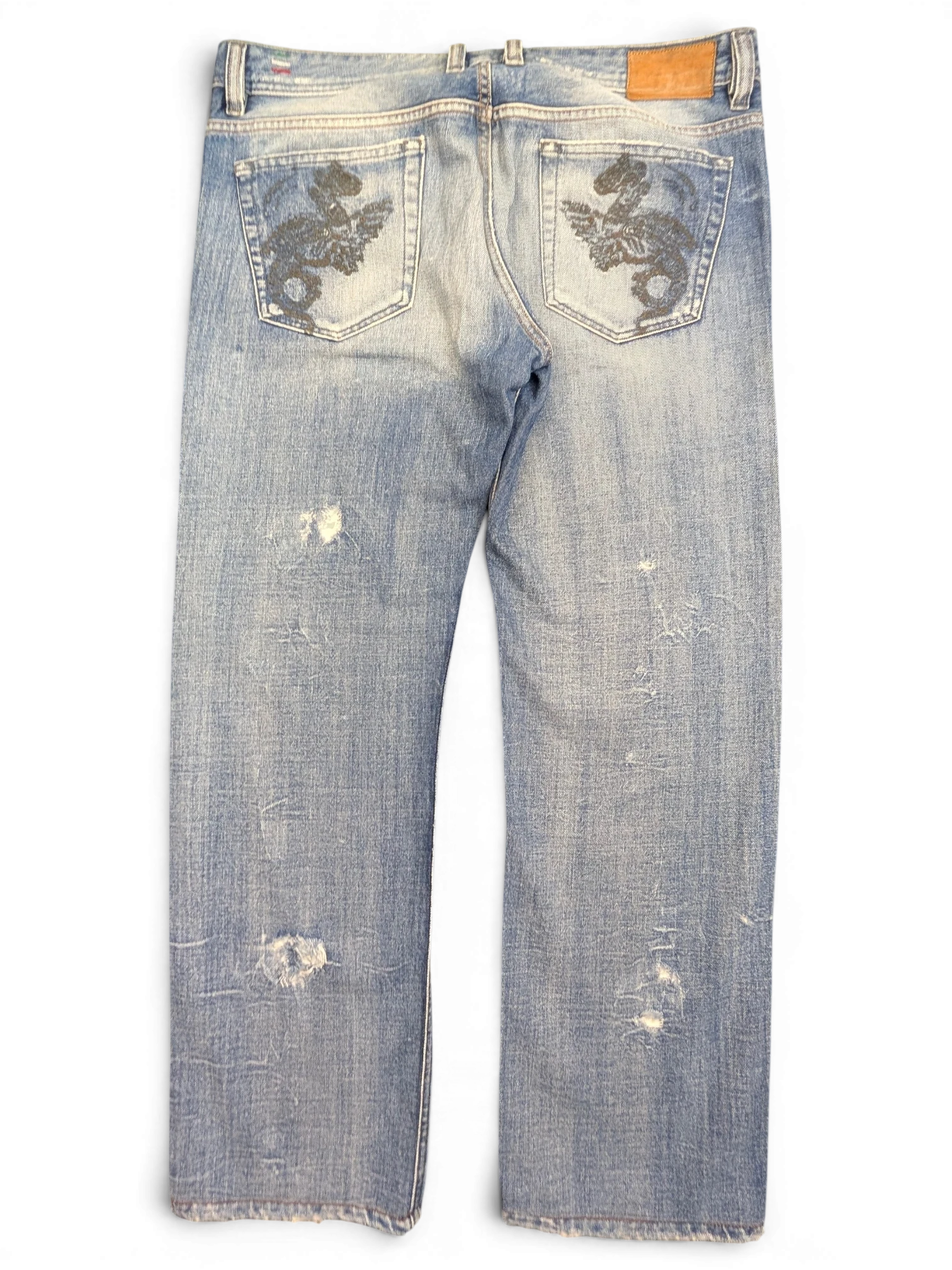 JAKE & IPI light wash denim jeans with distressed details and embroidered dragon design on back pockets. W36 L34.