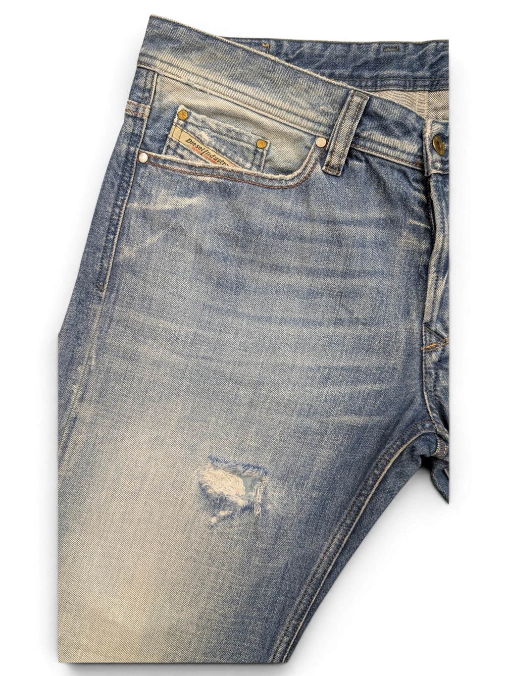 JAKE & IPI Diesel Viker light wash denim jeans with a distressed rip on the left leg and a coin pocket.