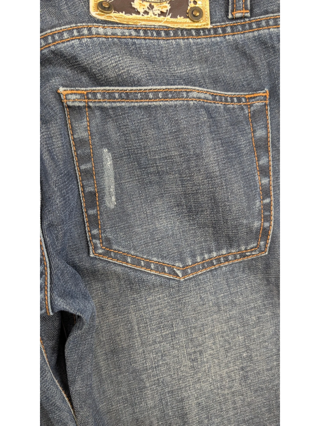 JAKE & IPI medium-wash blue denim straight-leg jeans with tobacco stitching and distressed detailing.