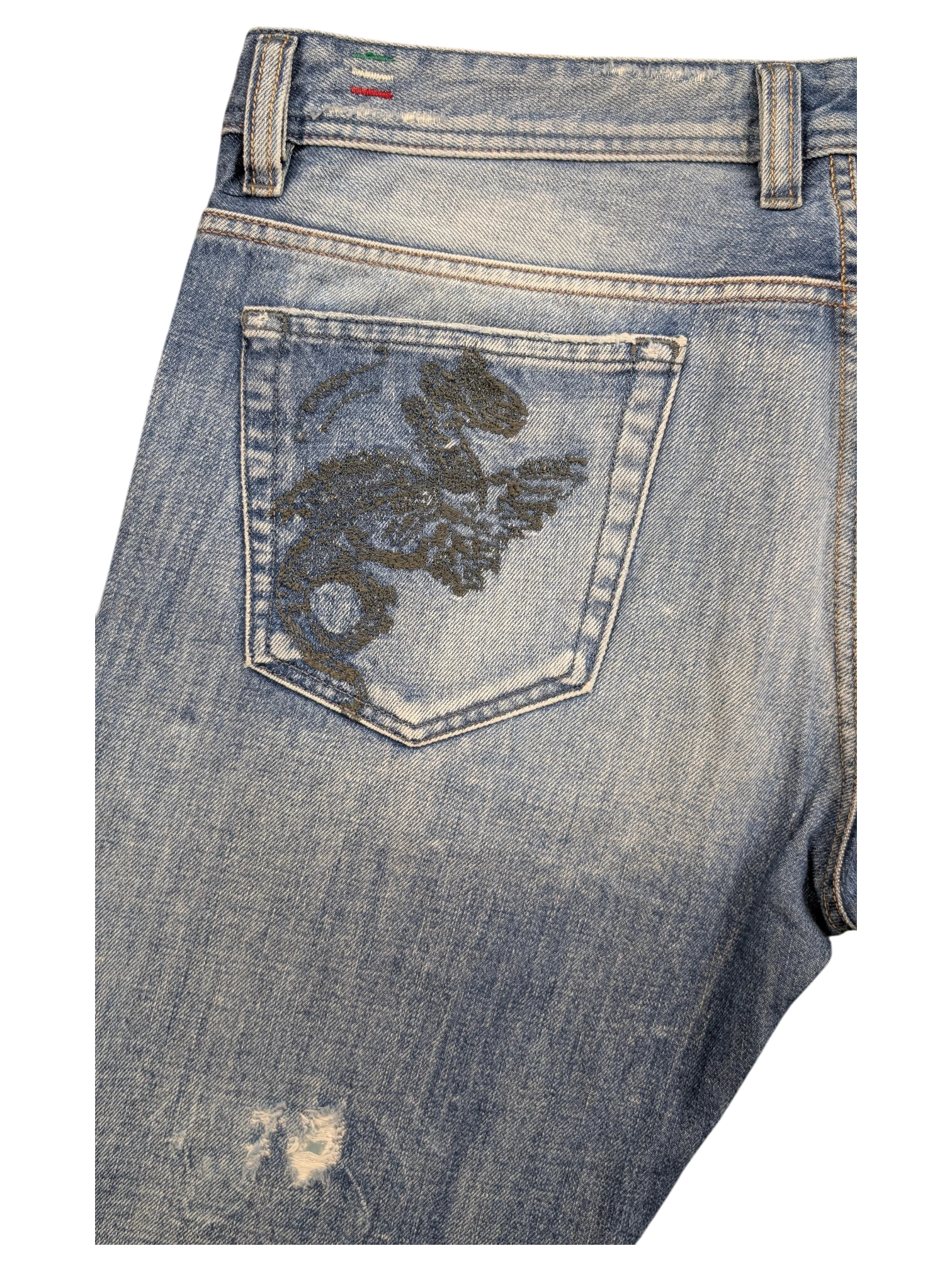 JAKE & IPI light wash denim jeans with embroidered dragon on back pocket and distressed detail.