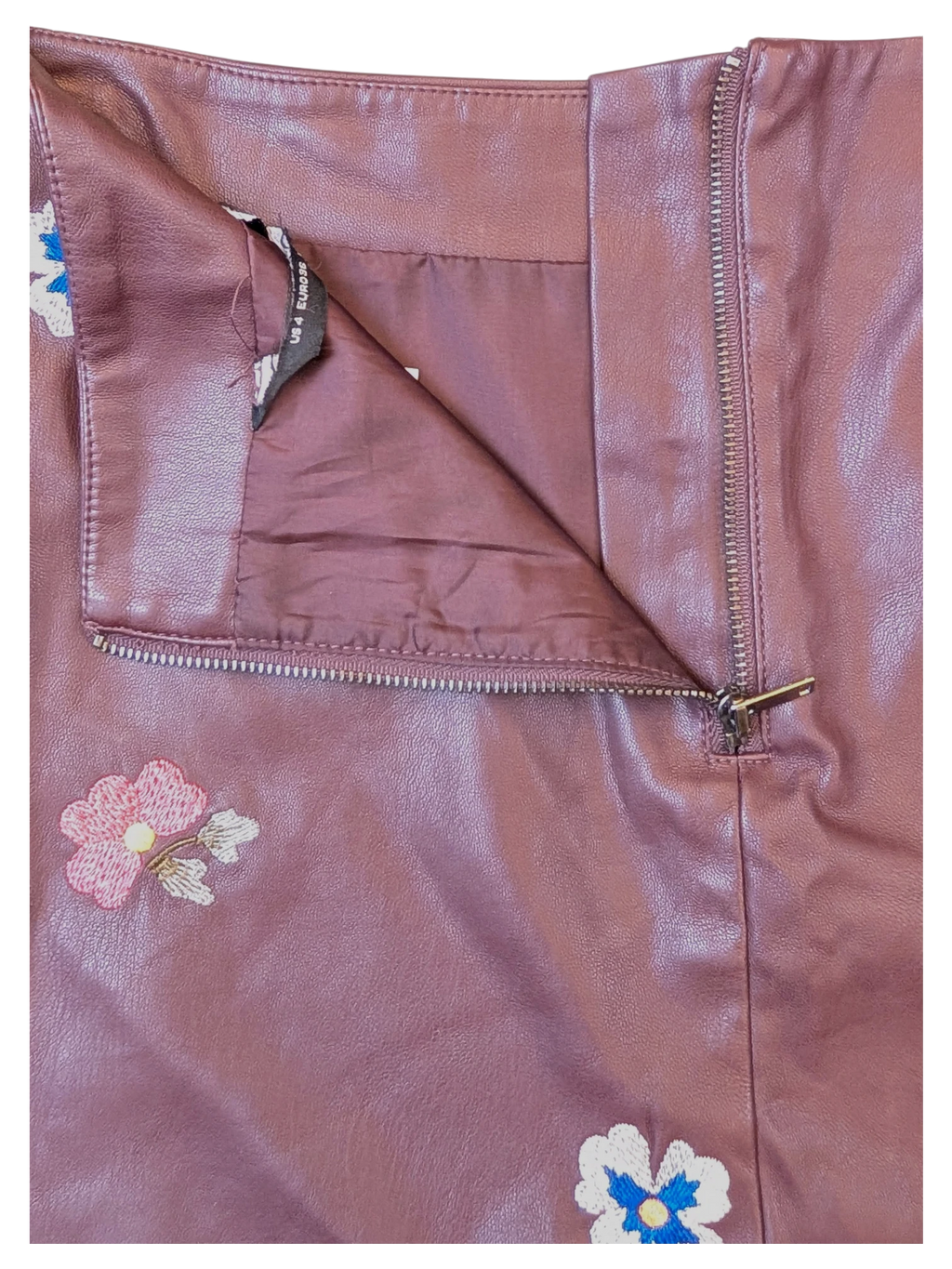 JAKE & IPI burgundy faux leather mini skirt with floral embroidery and side zipper closure.