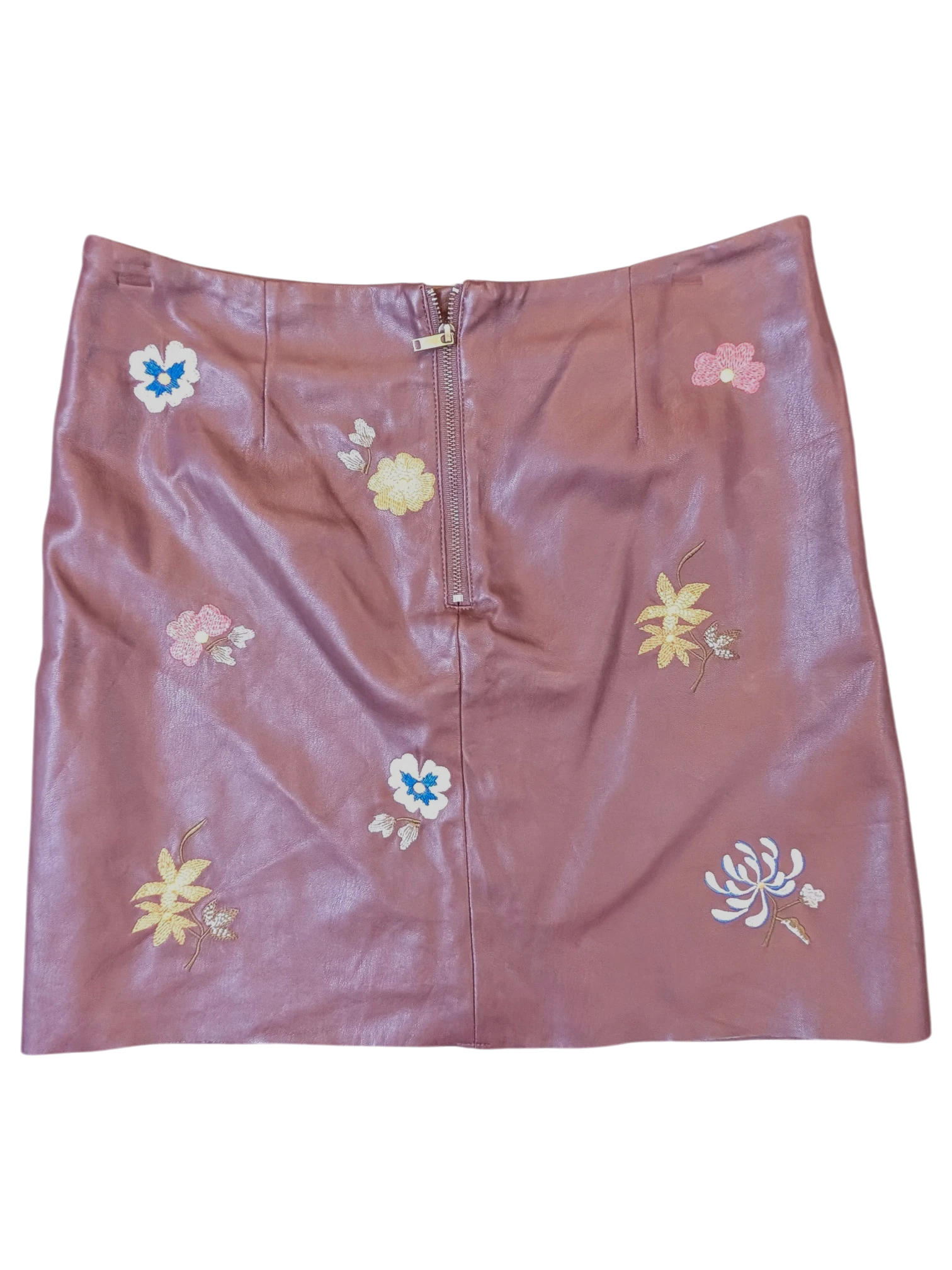 JAKE & IPI mauve faux leather mini skirt with colorful floral embroidery and a front zipper closure.