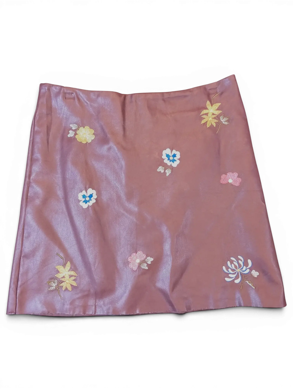 JAKE & IPI mauve faux leather mini skirt featuring delicate multi-colored floral embroidery throughout.