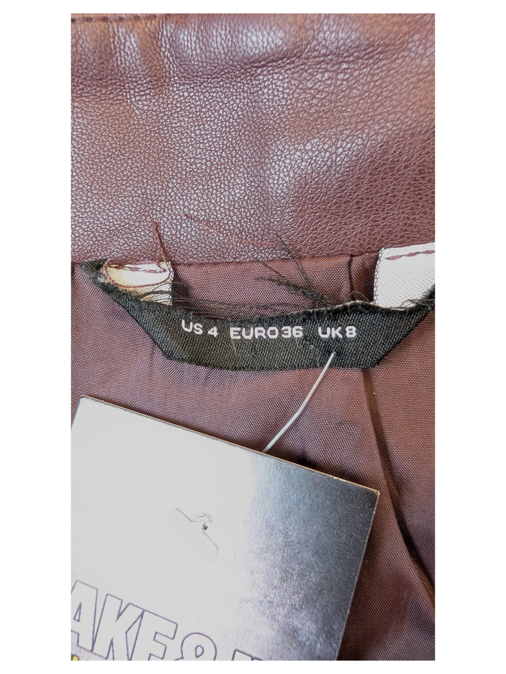 JAKE & IPI brown faux leather mini skirt with size label showing US 4, Euro 36, and UK 8.