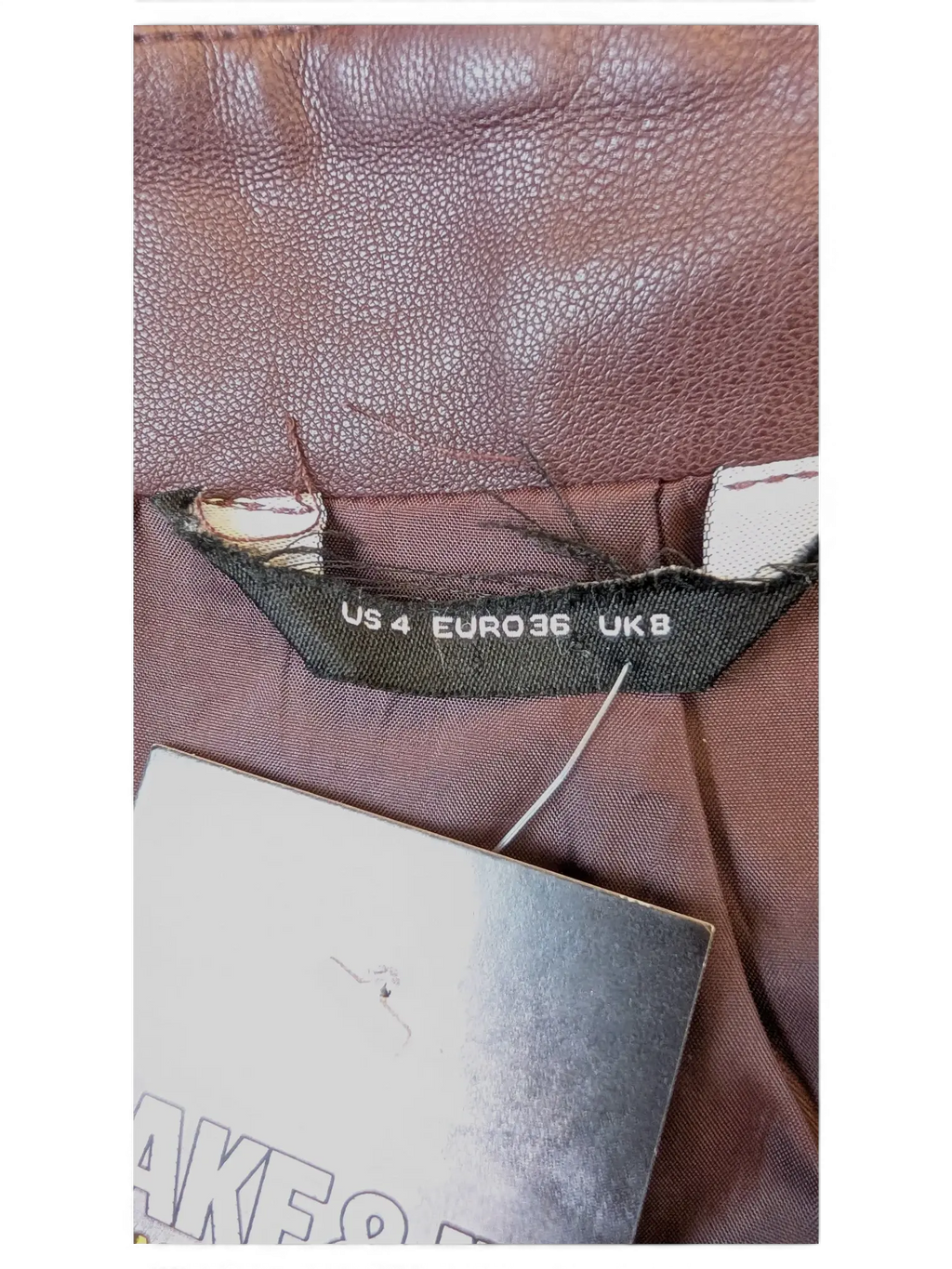 JAKE & IPI brown faux leather mini skirt with size label showing US 4, Euro 36, and UK 8.