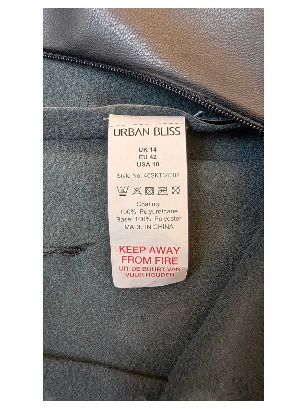 JAKE & IPI Urban Bliss black faux leather pleated mini skirt care label and interior fabric texture