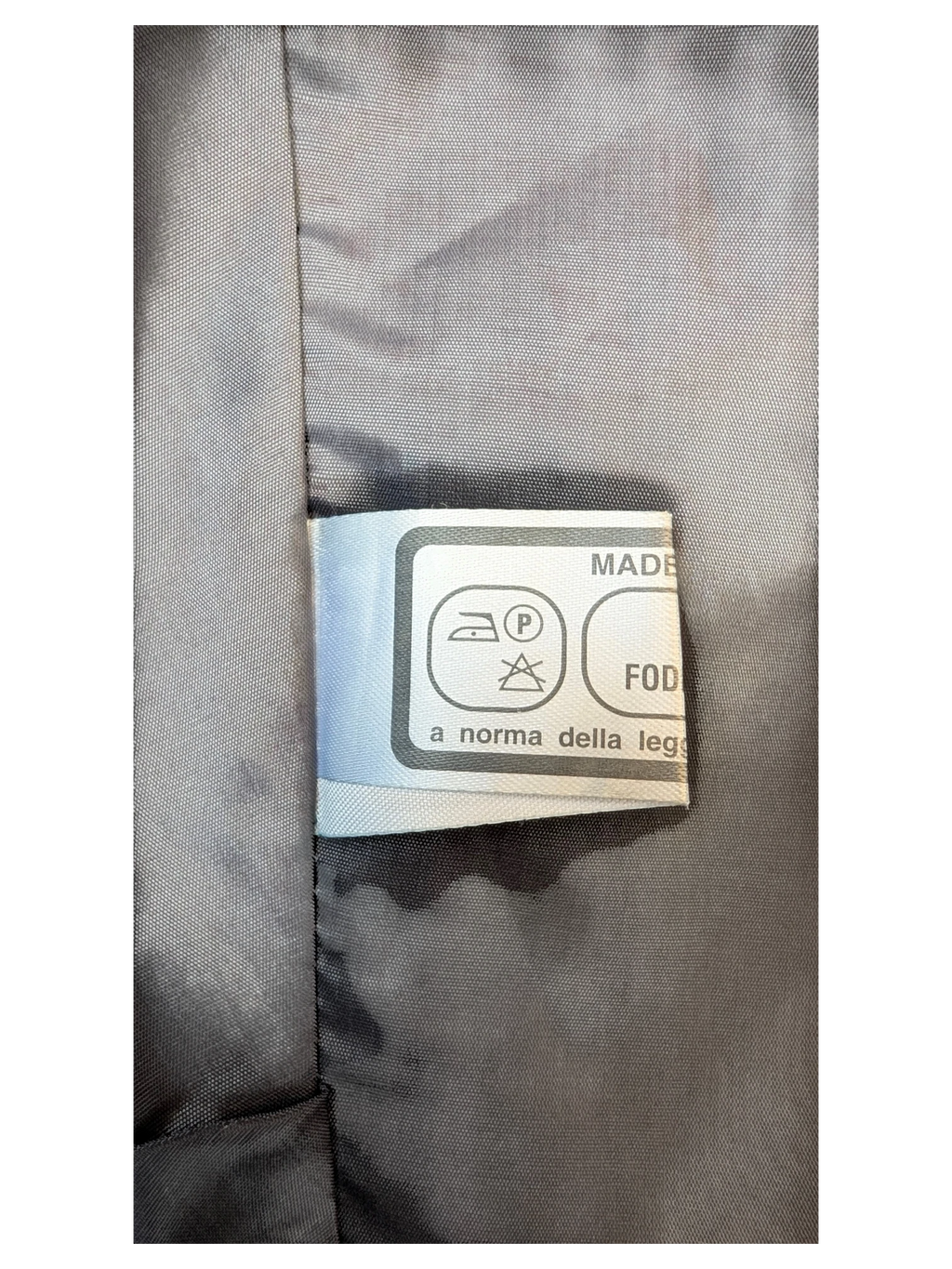 JAKE & IPI classic faux leather mini skirt interior care label with laundry symbols and fabric lining detail
