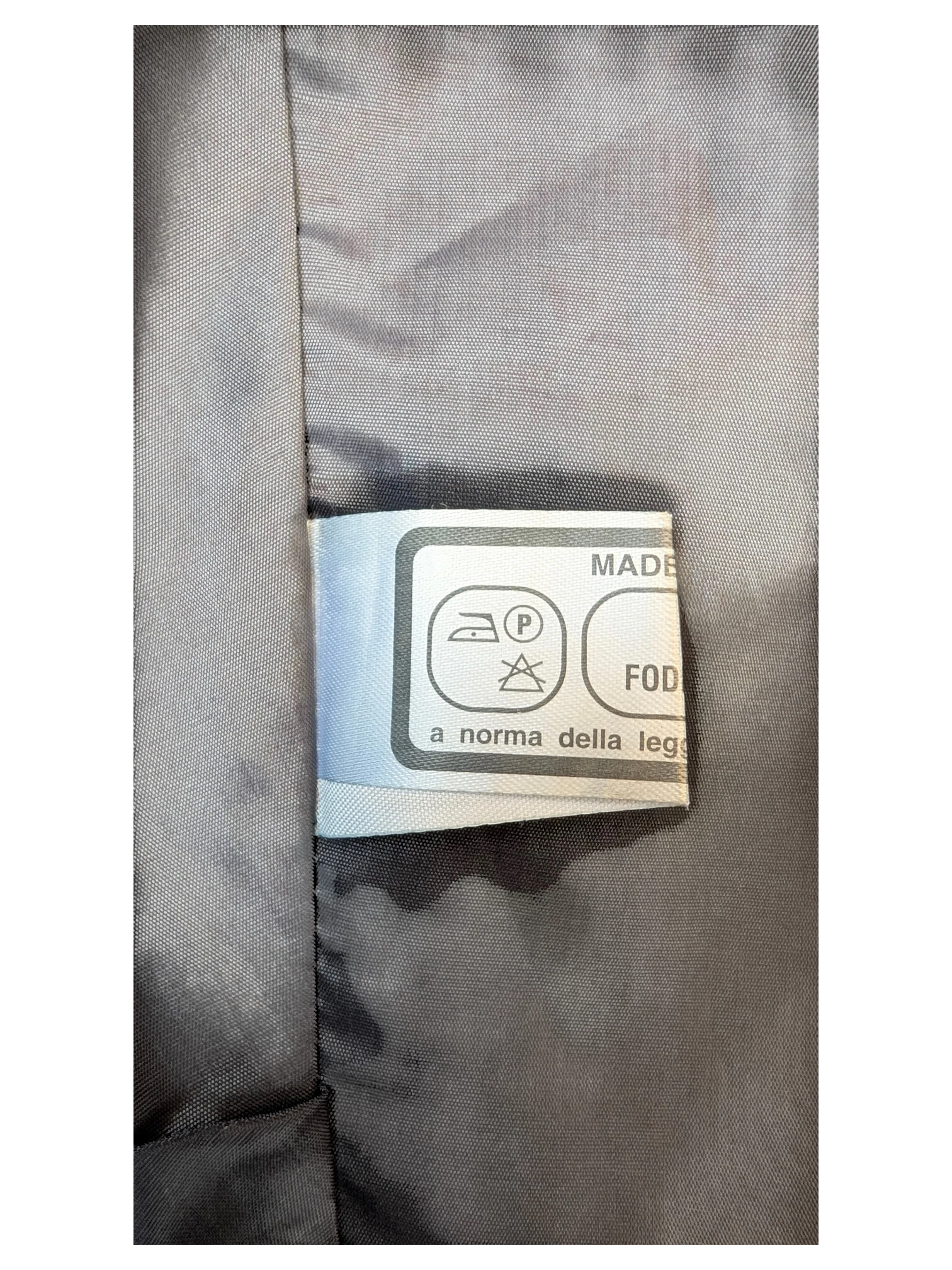 JAKE & IPI classic faux leather mini skirt interior care label with laundry symbols and fabric lining detail