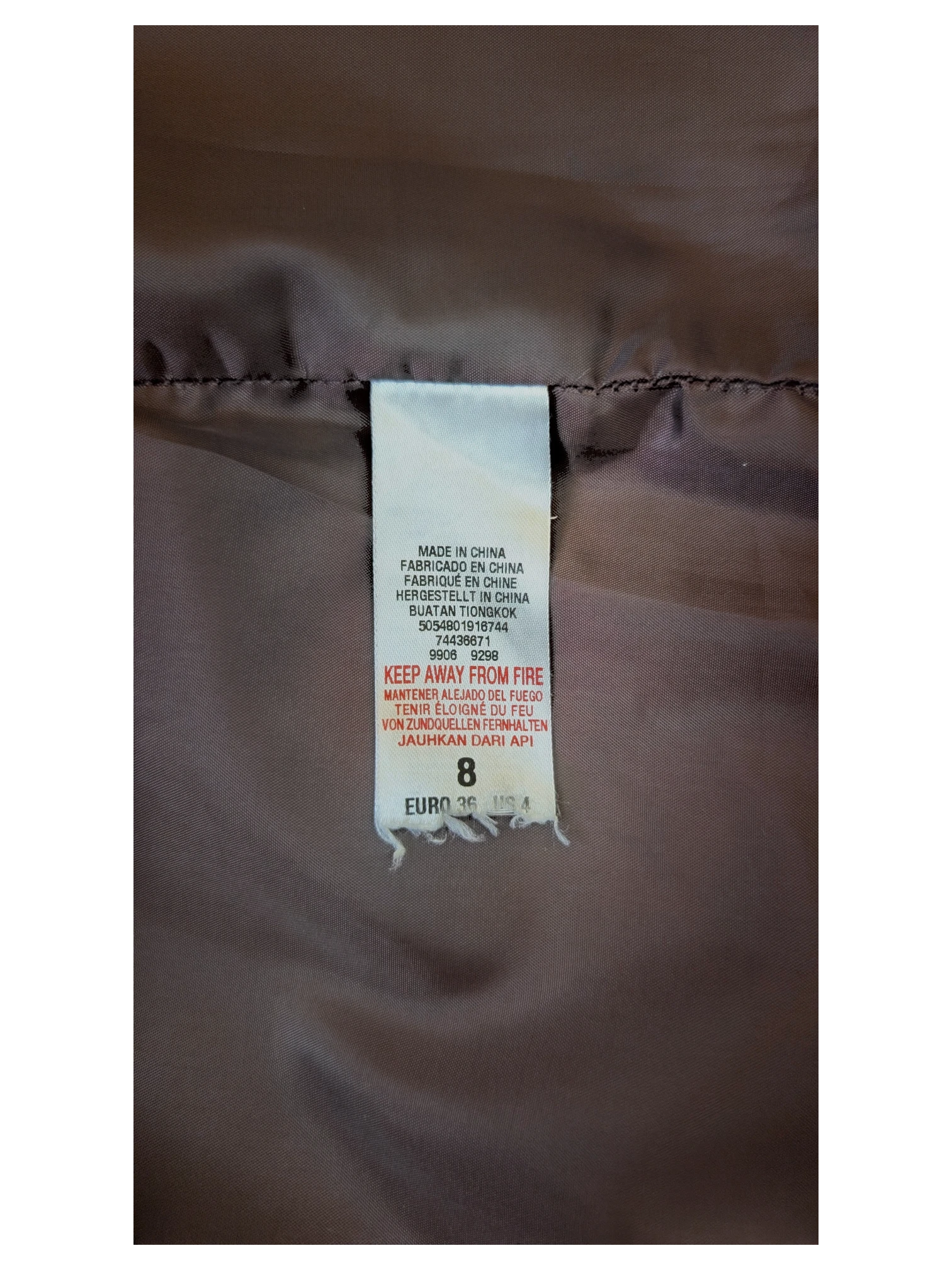 JAKE & IPI embroidered faux leather mini skirt interior garment care label showing size 8