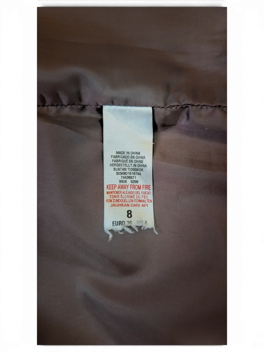 JAKE & IPI embroidered faux leather mini skirt interior garment care label showing size 8
