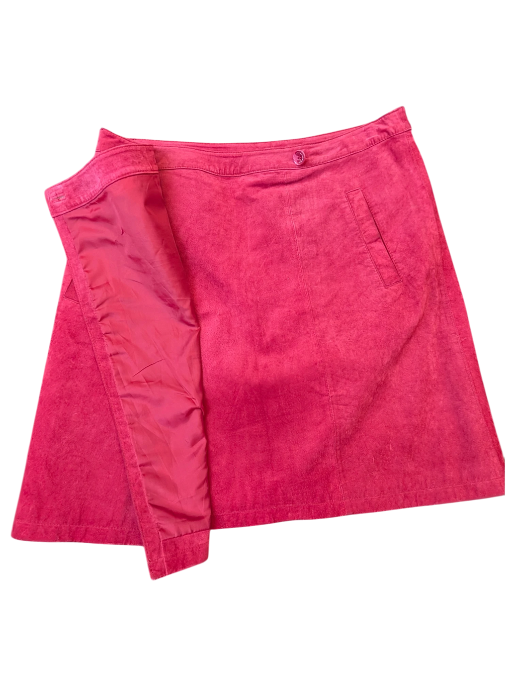 JAKE & IPI fuchsia pink suede leather mini skirt with a button closure and side pocket detail.