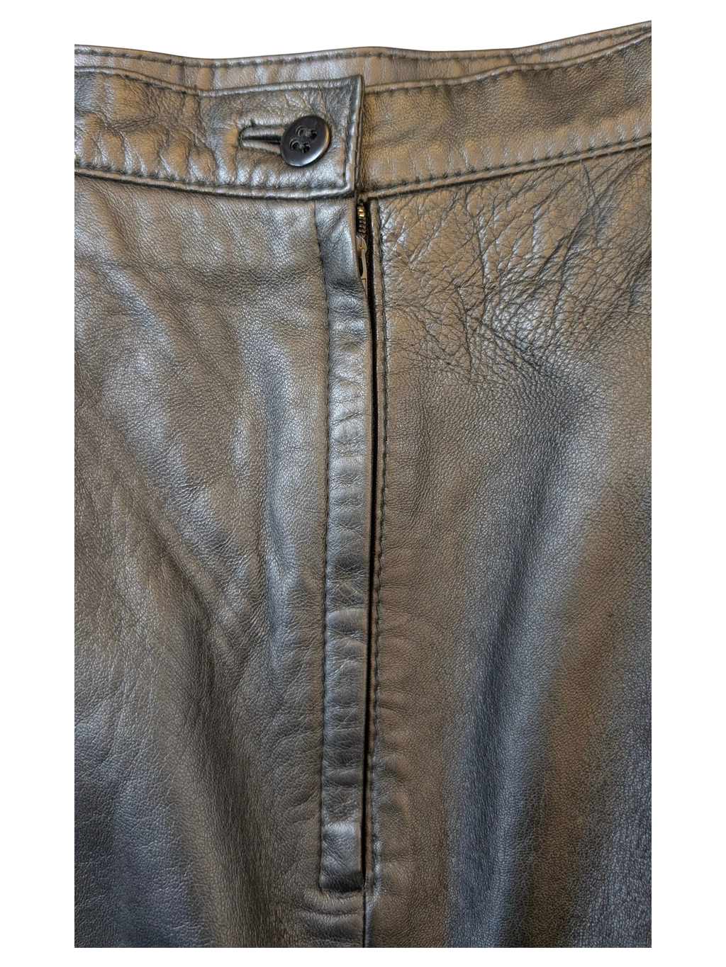JAKE & IPI Giorgio Mobiani black leather skirt featuring a button closure and a front zipper fly detail.