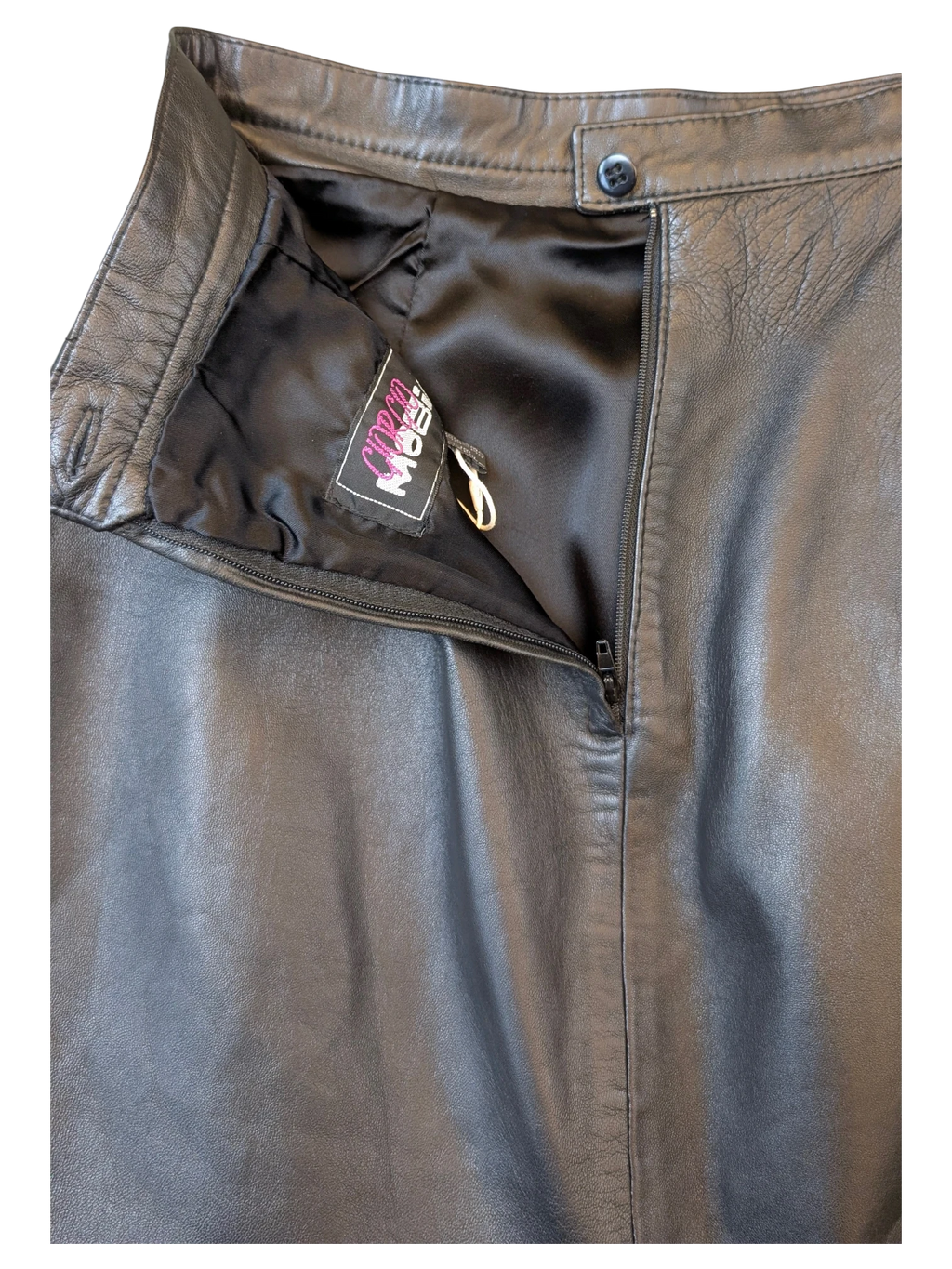 JAKE & IPI Giorgio Mobiani black leather skirt with a high-waisted button closure and side zipper detail.