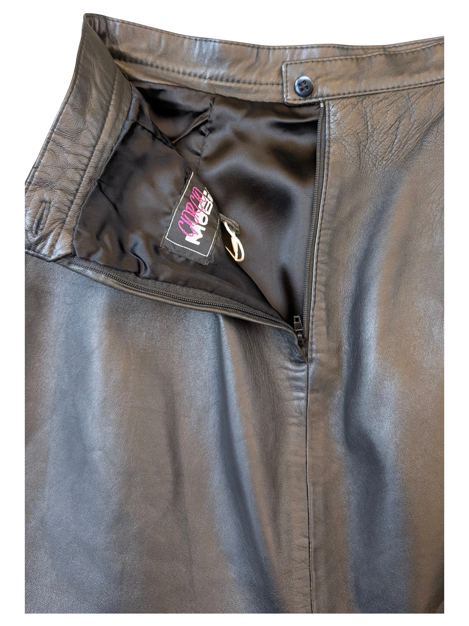 JAKE & IPI Giorgio Mobiani black leather skirt with a high-waisted button closure and side zipper detail.