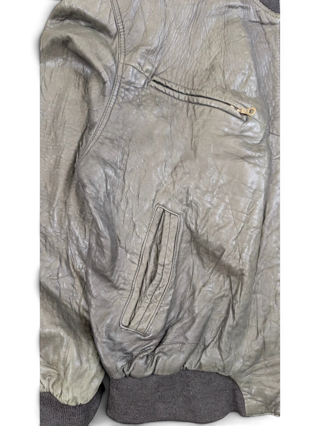 JAKE & IPI grey distressed leather bomber jacket with zip pocket and ribbed cuffs.
