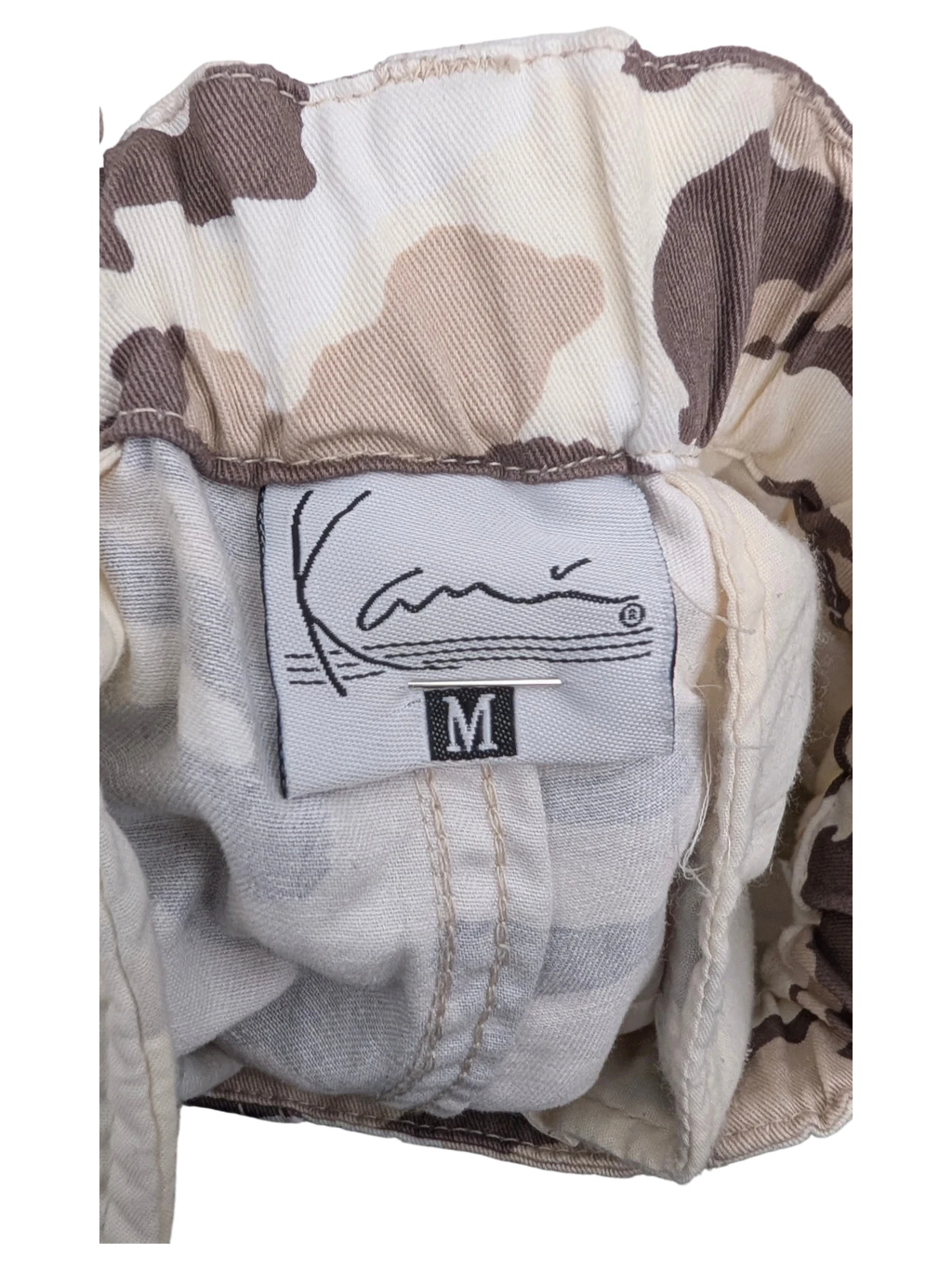 JAKE & IPI Karl Kani camouflage cargo pants in size M, featuring a tan and brown abstract pattern.