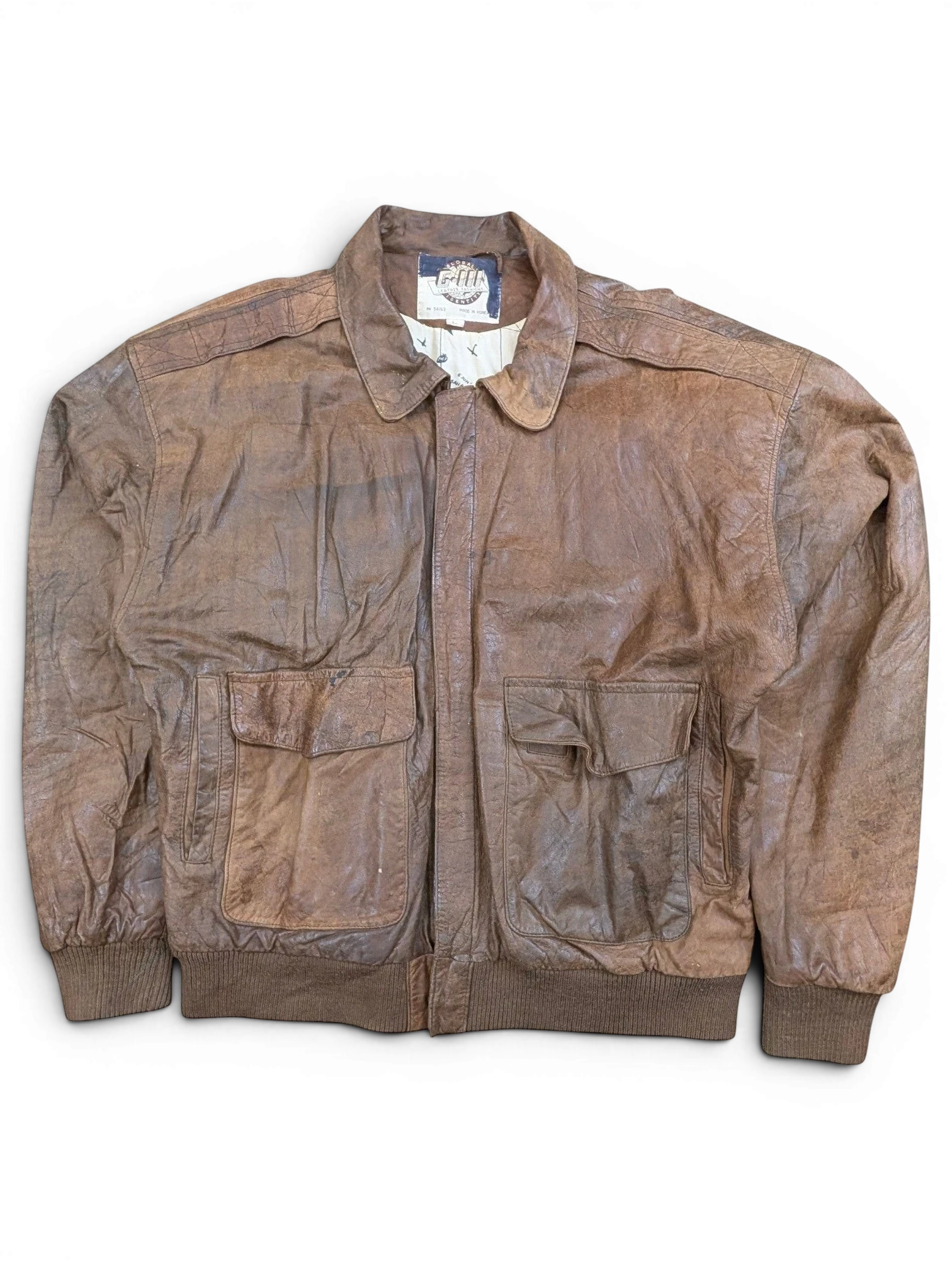 JAKE & IPI G-III leather bomber jacket in brown with two chest pockets and ribbed cuffs.