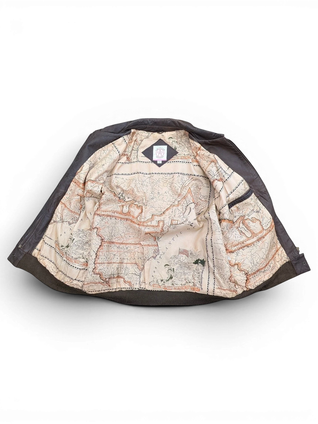 JAKE & IPI dark brown leather jacket with a unique map-print lining and ribbed cuffs.