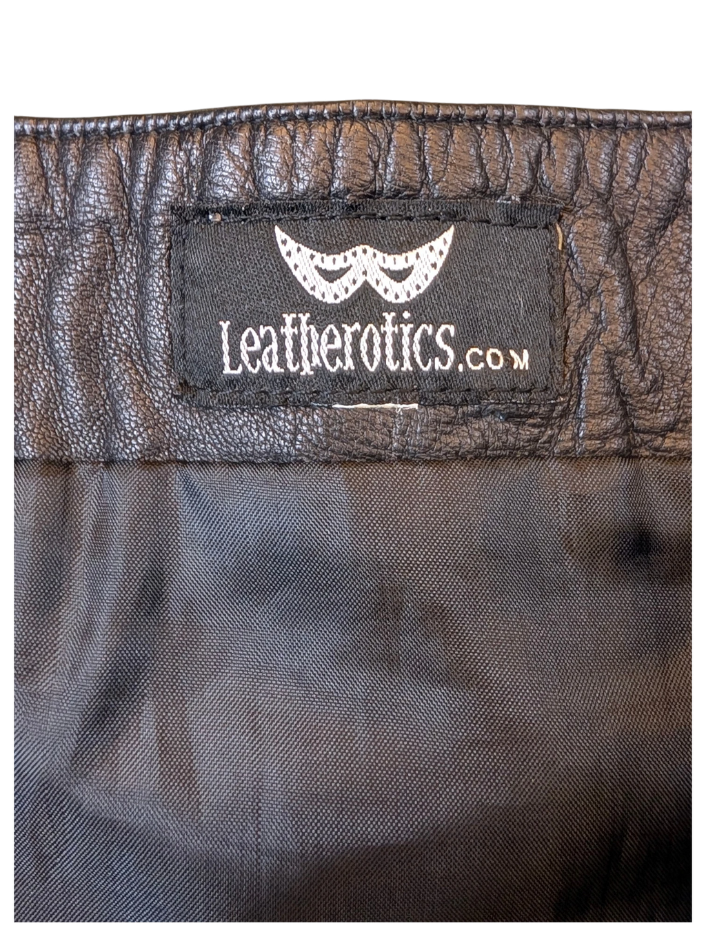 Black Leatherotics leather skirt label on textured black leather fabric from JAKE & IPI
