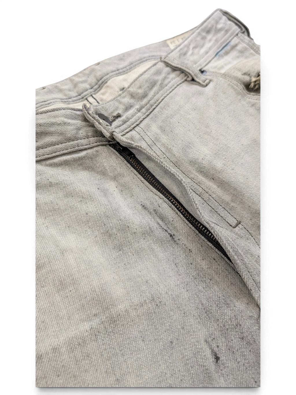 JAKE & IPI light grey distressed denim jeans with zip fly and button closure, size W34 L34.