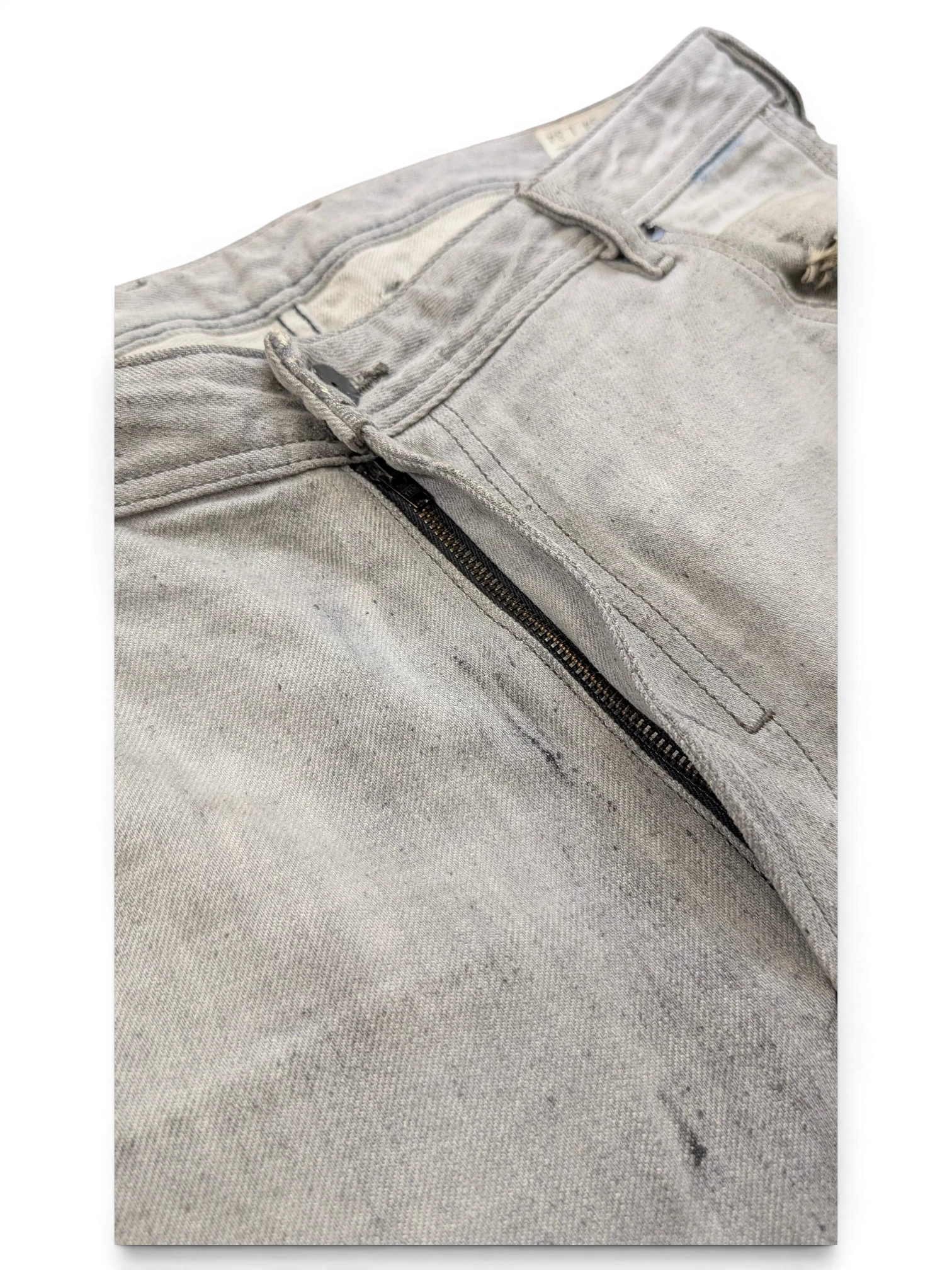 JAKE & IPI light grey distressed denim jeans with zip fly and button closure, size W34 L34.