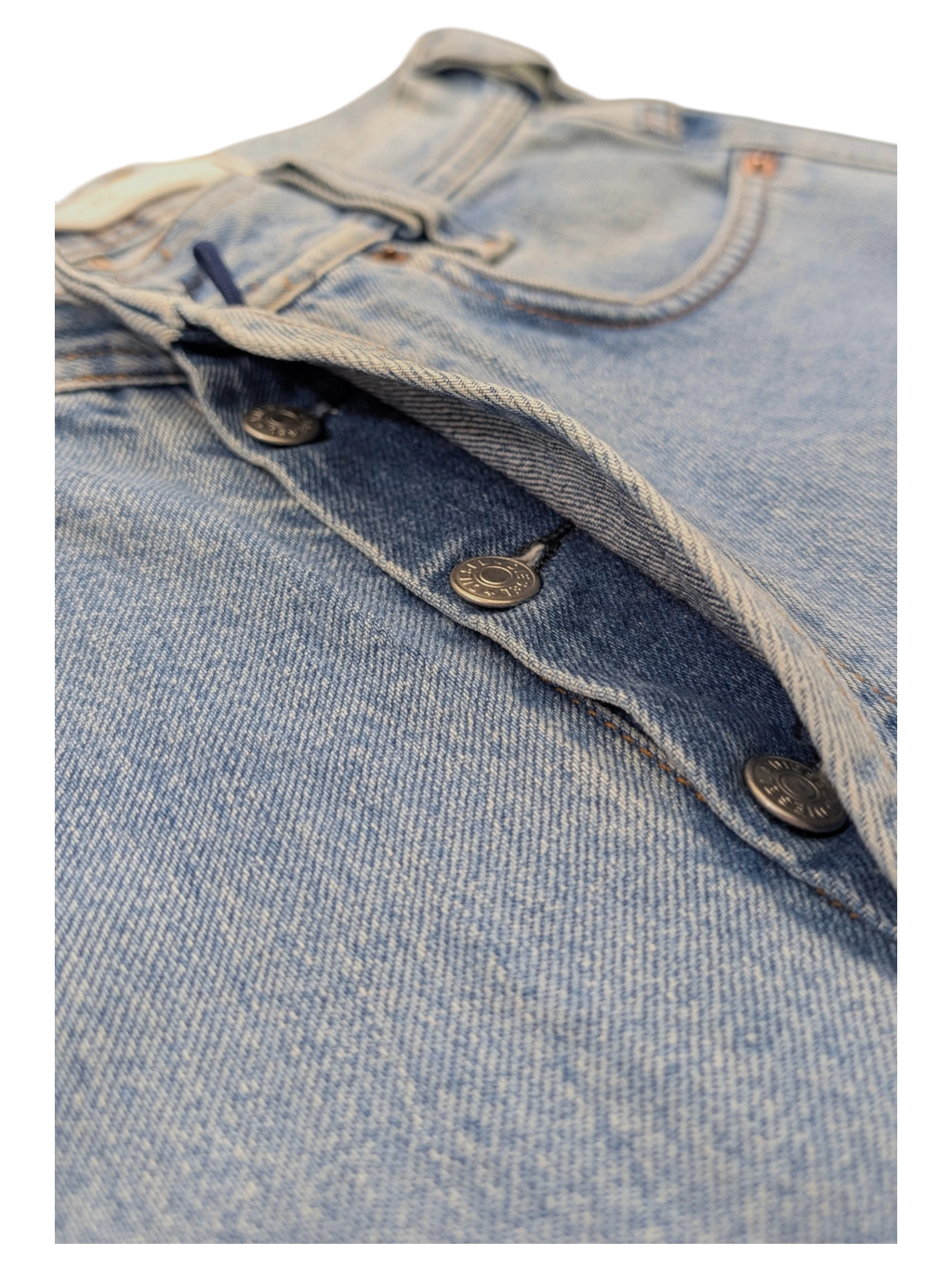 JAKE & IPI light wash denim jeans with button fly closure and metal buttons.