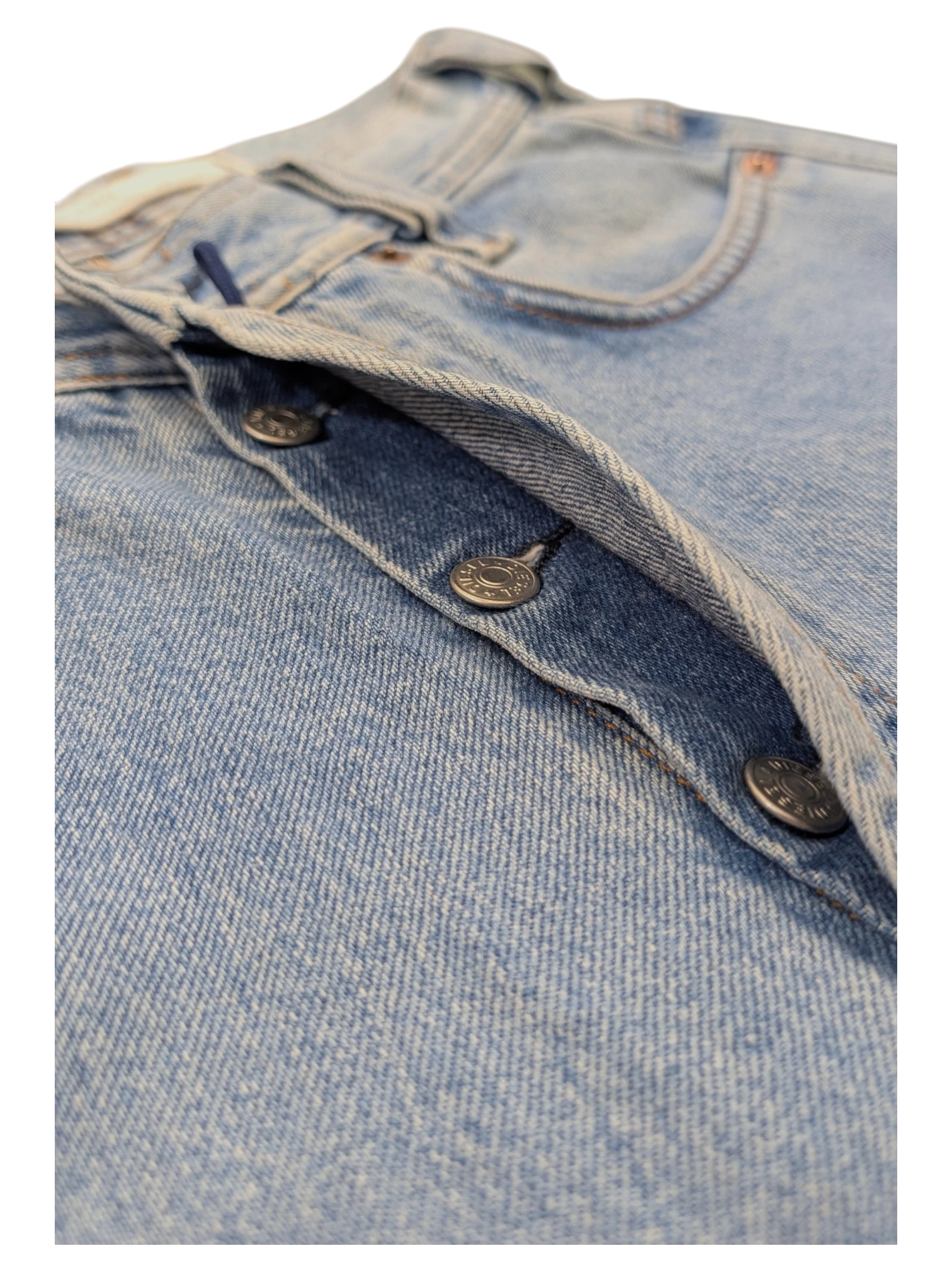 JAKE & IPI light wash denim jeans with button fly closure and metal buttons.