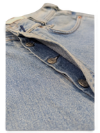 JAKE & IPI light wash denim jeans with button fly closure and metal buttons.